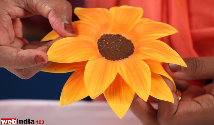 Apply glue on the other flower attach