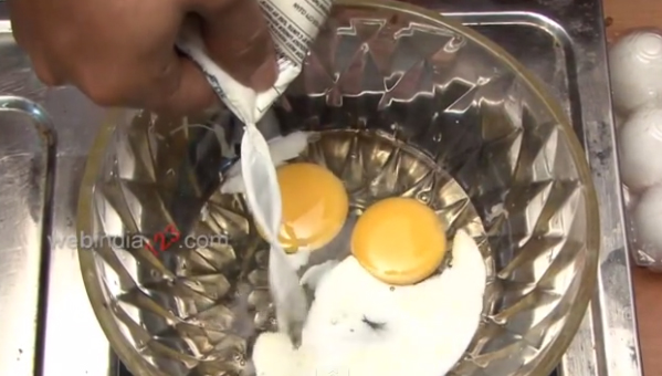 Break two eggs and add some milk