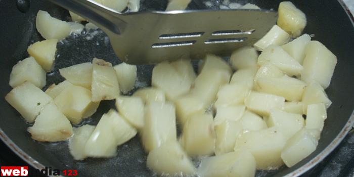 stir-fry the boiled potatoes