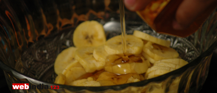 sliced bananas in add honey