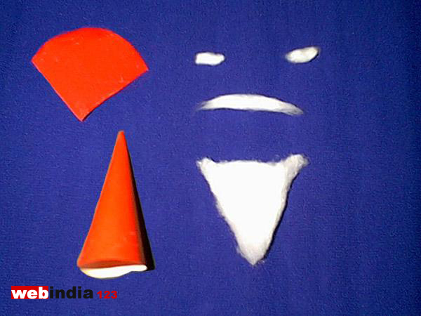 Pieces of cotton and red varnish paper cut and folded