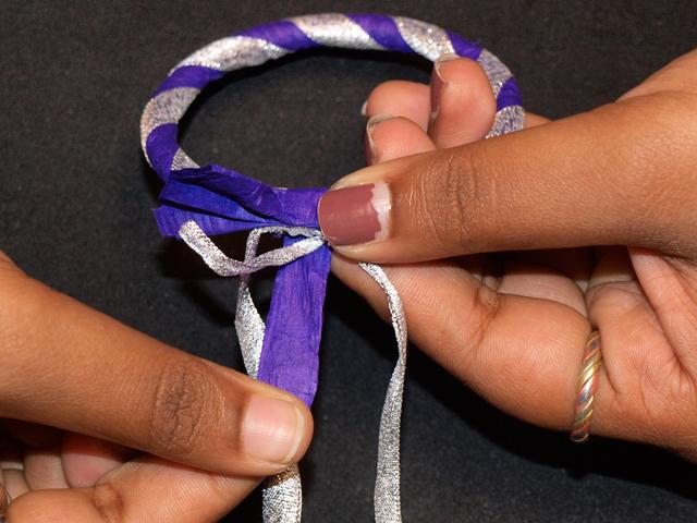 Place the bow on top of the bangle