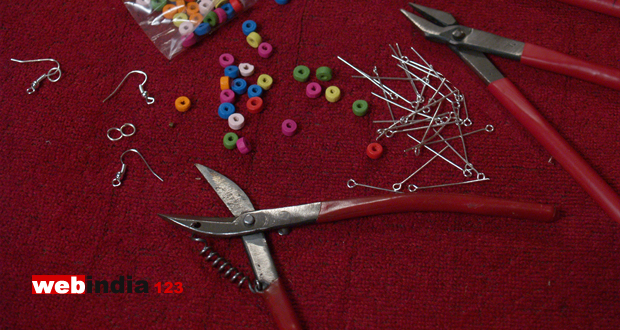 Three different coloured wooden beads