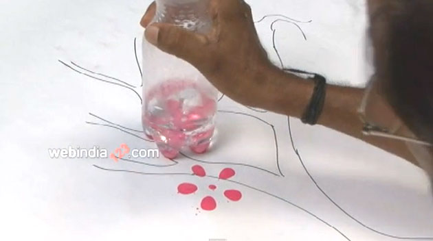 Making pink petal prints with the bottle