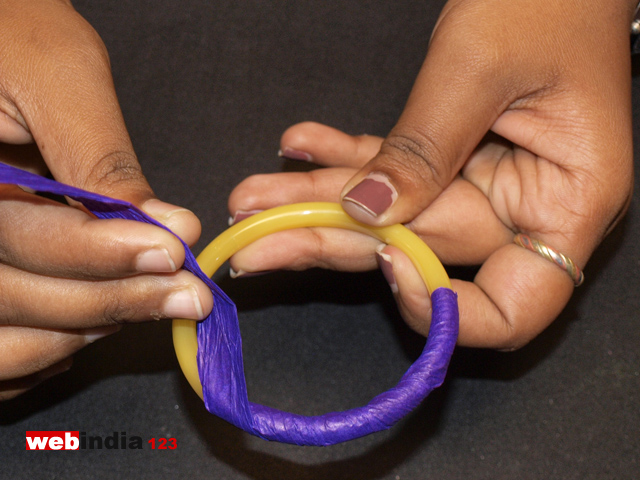 wind a strip of crepe paper around the bangle to cover it