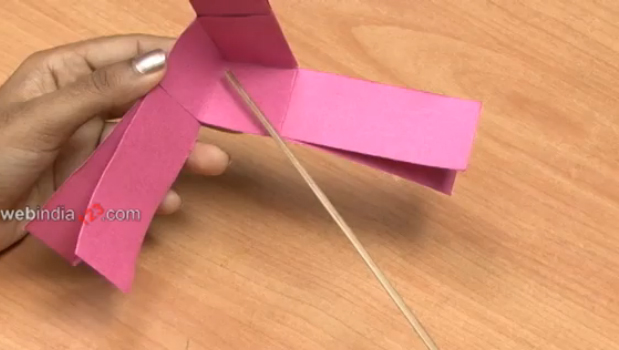 paper Fan windmill over a thin bamboo piece