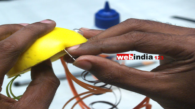 attaching quill curls to the sponge ball