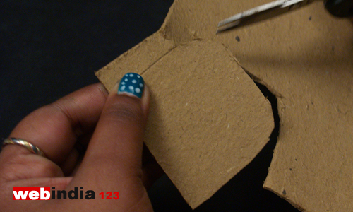 cut out a small shape as shown from the cardboard