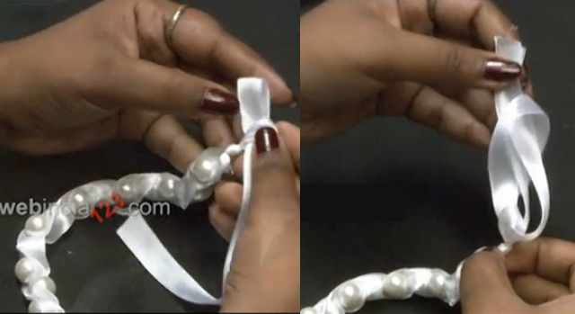 Take two pieces of satin ribbon and attach it to both ends