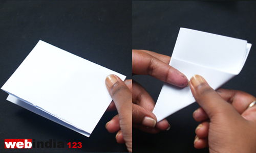 Fold the paper into four. Again fold it as triangle shape