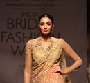 A+model+walks+the+ramp+showcasing+an+outfit+designed+by+Tarun+Tahiliani+during+the+Aamby+Valley+India+Bridal+Fashion+Week+%28IBFW%29+2013%2C+in+Mumbai%2C+India+on+November+29%2C+2013