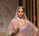 A+model+walks+the+ramp+showcasing+an+outfit+designed+by+Tarun+Tahiliani+during+the+Aamby+Valley+India+Bridal+Fashion+Week+%28IBFW%29+2013%2C+in+Mumbai%2C+India+on+November+29%2C+2013