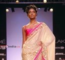 A+model+display+creation+of+Bollywood+actor+and+fashion+designer+Mandira+Bedi+during+the+Lakme+Fashion+Week+%28LFW%29+Summer%2F+Resort+2014+in+Mumbai%2C+India+on+March+13%2C+2014%2E