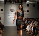 A+model+walks+the+ramp+displaying+an+oufit+from+Koecsh+by+Kresha+Bajaj%2C+during+the+Lakme+Fashion+Week+Summer%2FResort+2014%2C+in+Mumbai%2C+India+on+March+14%2C+2014%2E+